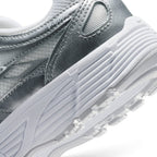 Highlights the "unreal" clean finish where the sculpted white foam midsole meets the grooved rubber outsole tread and metallic silver midfoot cage.