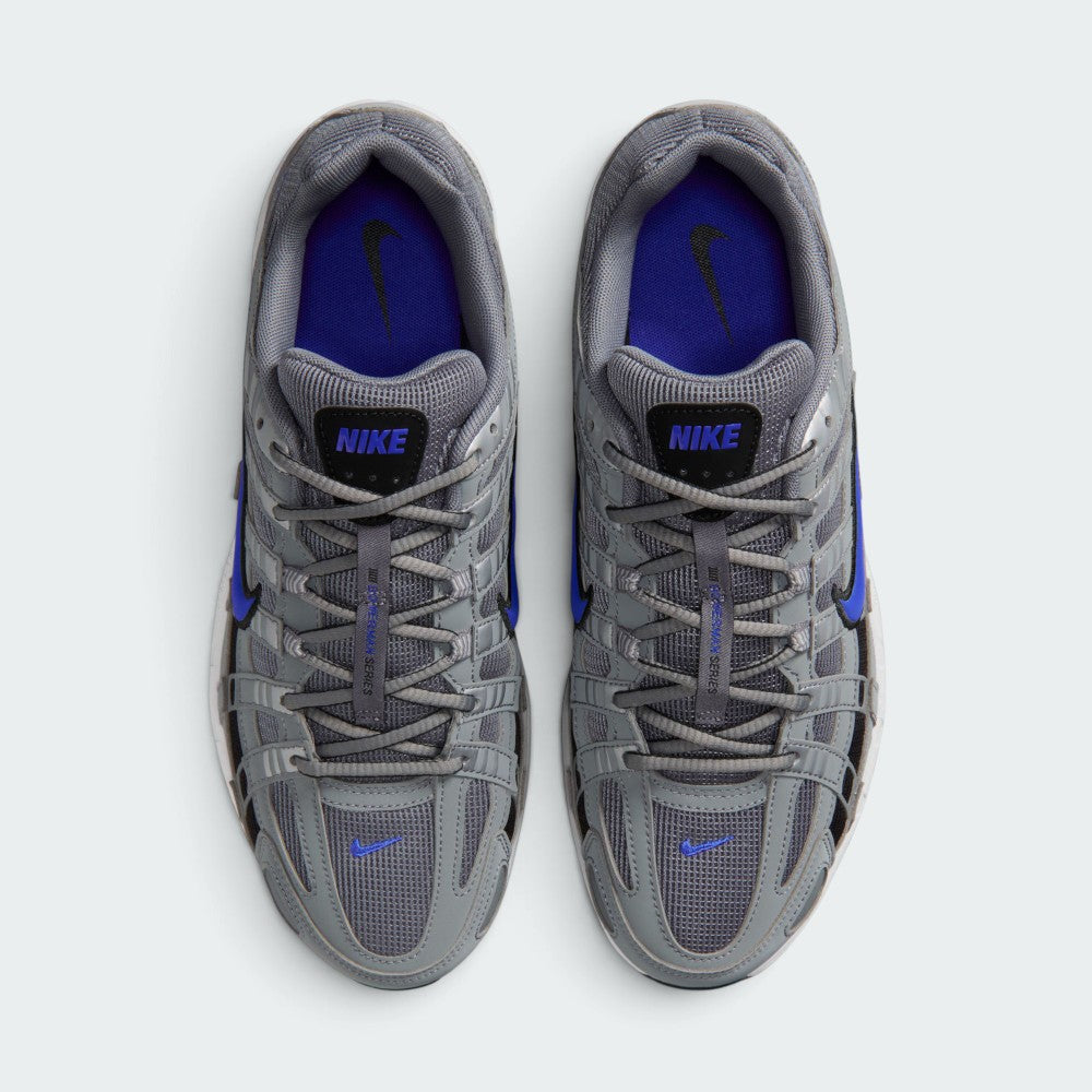 Focuses on the locked-in central lacing layout, displaying the clean symmetry of the grey textile mesh tongues, matching laces, central "BOWERMAN SERIES" ribbon, and vibrant Racer Blue insoles with black Swoosh logos.