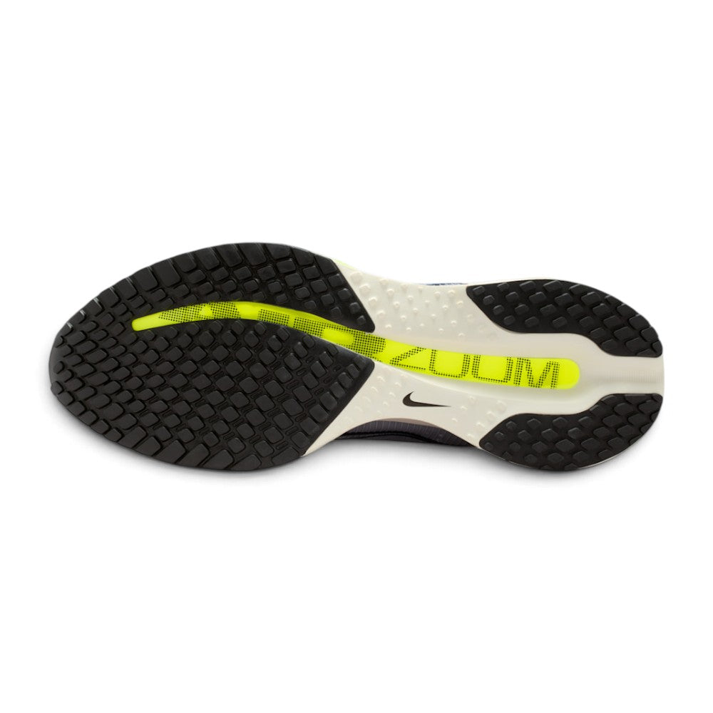 Focusing on the durable modified Waffle outsole featuring high-abrasion rubber lug geometry, forefoot transition channels, and exposed central Air Zoom window, showcasing the road grip matrix engineered for a successful tackle of wet tarmac, asphalt roads, and running tracks.