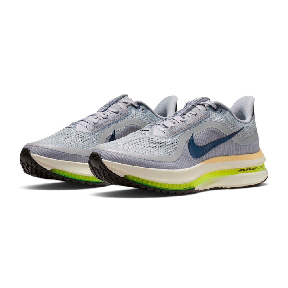 Showcasing the "unreal" clean lines, heritage grey-to-navy colourway contrast, and sculpted kinetic midsole stack from a 45-degree perspective.