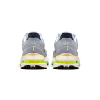 Showing the structured rear heel counter construction, detailing the springy ReactX foam heel crash pad, dual reflective vertical accents, internal supportive heel cup, and bevelled 10mm-drop geometry.