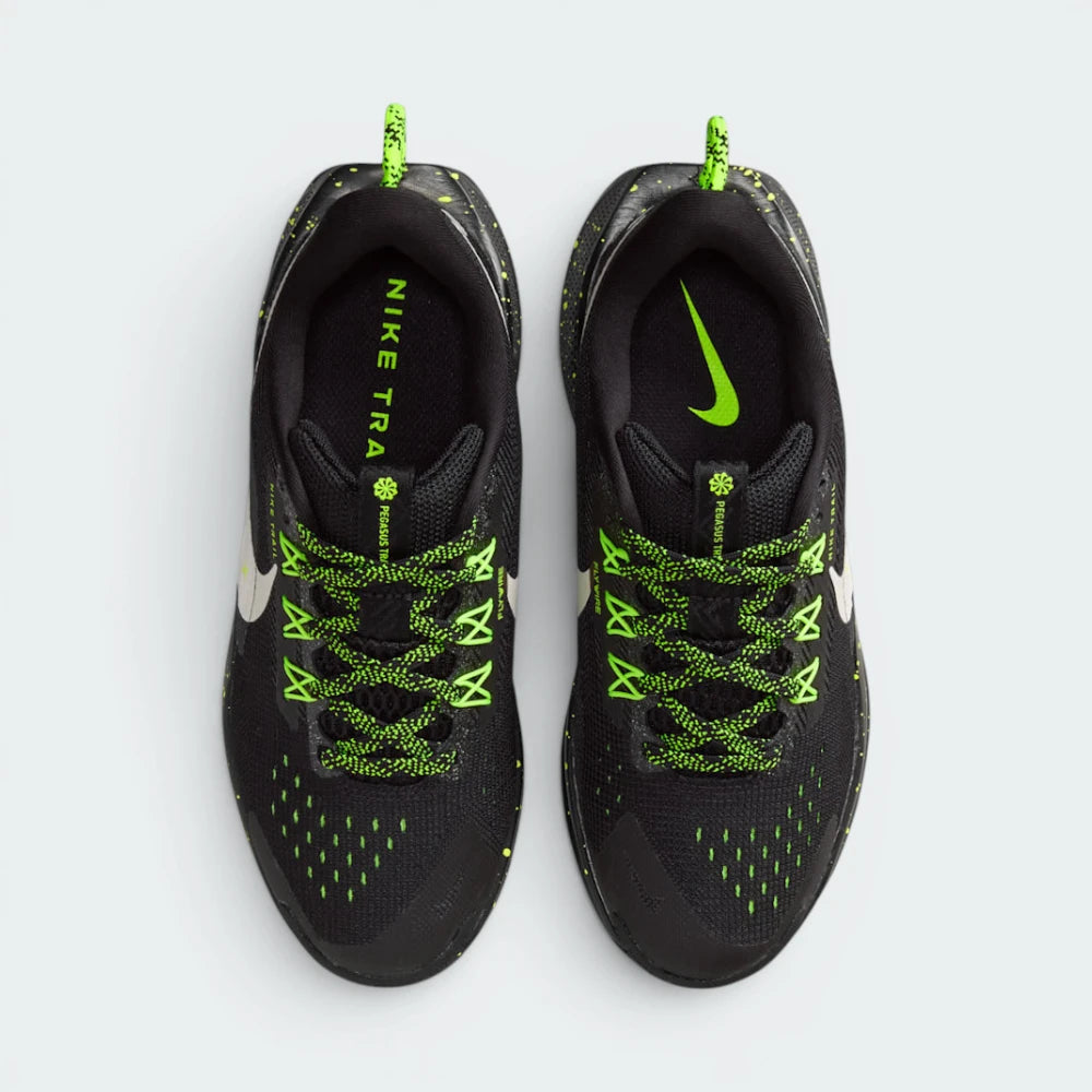 Focuses on the locked-in classic lacing layout, displaying the perfect symmetry of the perforated mesh toe box, the integrated Flywire support bands tracking along the eyelets, and the black pull tab sitting squarely on the tongue.