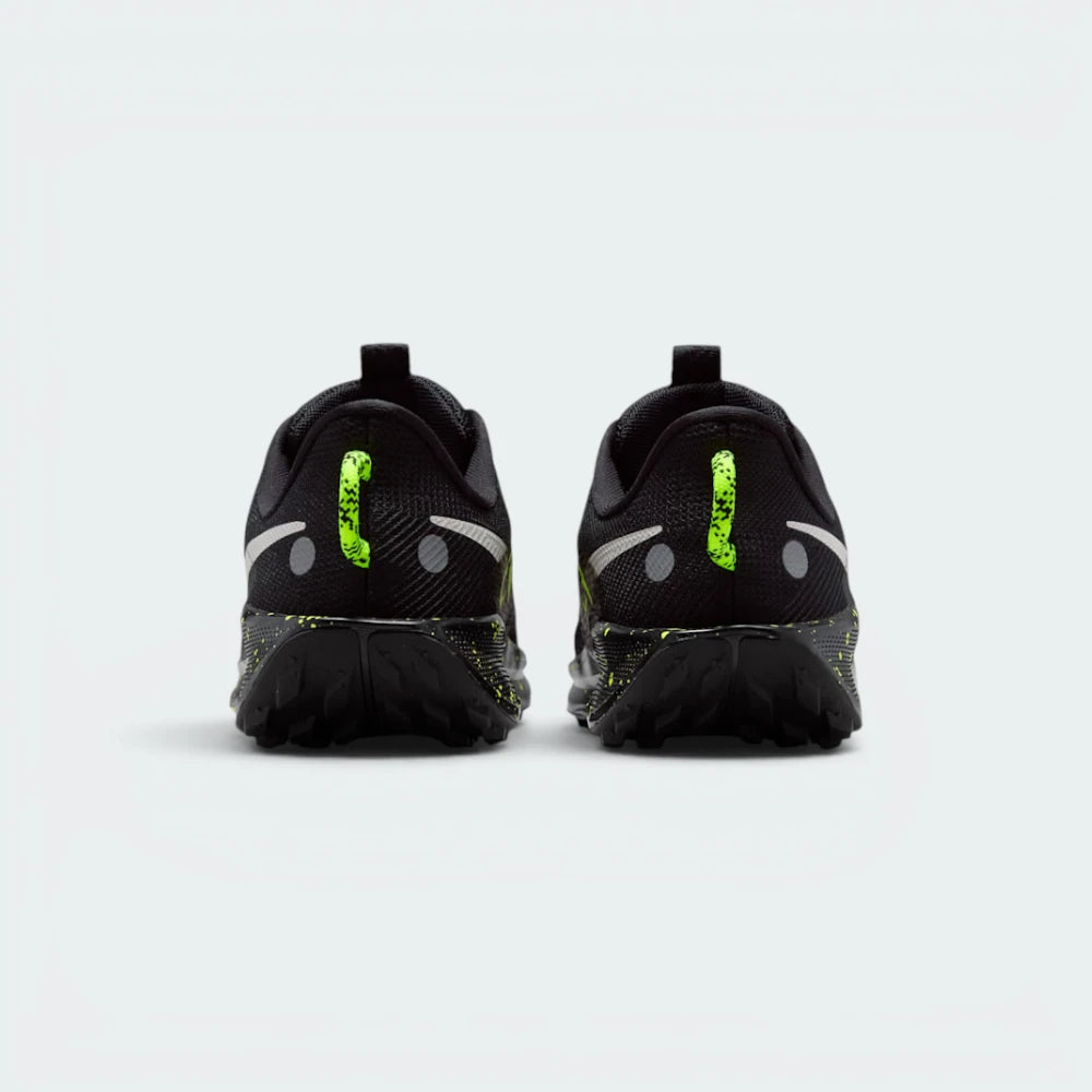 Focuses on the contoured shape of the padded ankle collar, highlighting the reflective heel strip, the rugged webbing heel pull tab, and the wide heel base designed for landing stability.