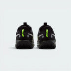 Focuses on the contoured shape of the padded ankle collar, highlighting the reflective heel strip, the rugged webbing heel pull tab, and the wide heel base designed for landing stability.