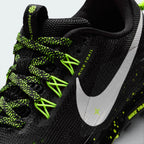 Details the premium precision of the heat-welded synthetic overlays wrapping the front toe box to defend against rock impacts, alongside the clean placement of the miniature Volt Ice Swoosh.