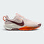 Highlights the lateral profile featuring a Dark Team Red Nike Swoosh sweeping across the Silt Red mesh upper, pale blue Flywire lace loops, Sail ReactX foam midsole with a vibrant Hyper Crimson front midsole section, and the debossed "NIKE TRAIL ATC" outsole badge.