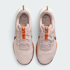 Focuses on the locked-in lacing layout, displaying the Silt Red mesh tongues, matching laces, pale blue Flywire eyelet cables, orange "PEGASUS TRAIL 5" tongue pull ribbons, and custom topographic trail map printed insoles.