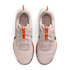 Focuses on the locked-in lacing layout, displaying the Silt Red mesh tongues, matching laces, pale blue Flywire eyelet cables, orange "PEGASUS TRAIL 5" tongue pull ribbons, and custom topographic trail map printed insoles.