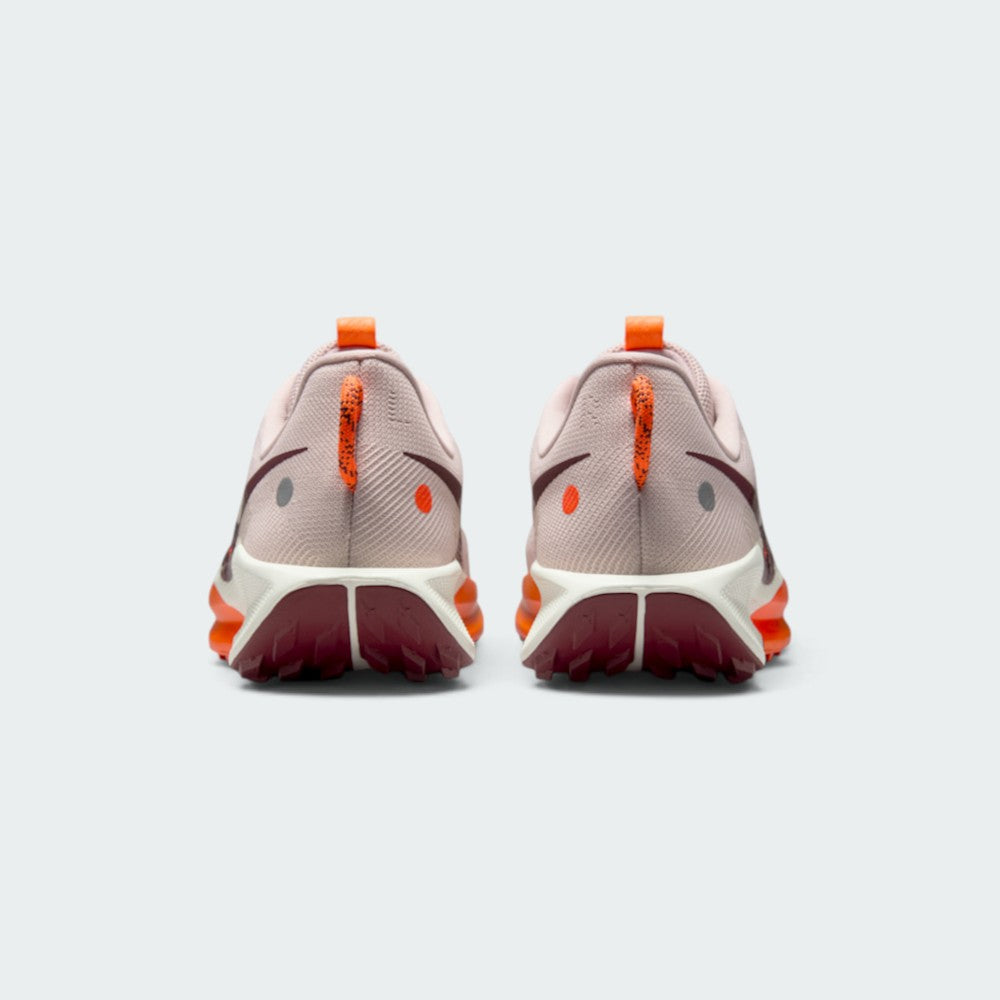 Focuses on the rear profile, highlighting the Hyper Crimson speckled pull loops, circular reflective and orange dots on the heel counters, and the wide footprint of the Sail ReactX midsole base.