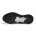 Displays the full-length black and white generative rubber outsole, showcasing the dense pod traction grid, central white foam core window, and debossed mini Swoosh.