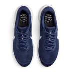Focuses on the locked-in central lacing layout, displaying the navy laces, mesh tongues with white "NIKE REVOLUTION" branding text, padded navy collars, and black insoles stamped with white "COMFORT FOOTBED" graphics.