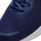 Details the micro-precision of the forefoot area, showing the open-weave navy knit toe box, bonded protective toe arc, navy laces, and reinforced eyestays.