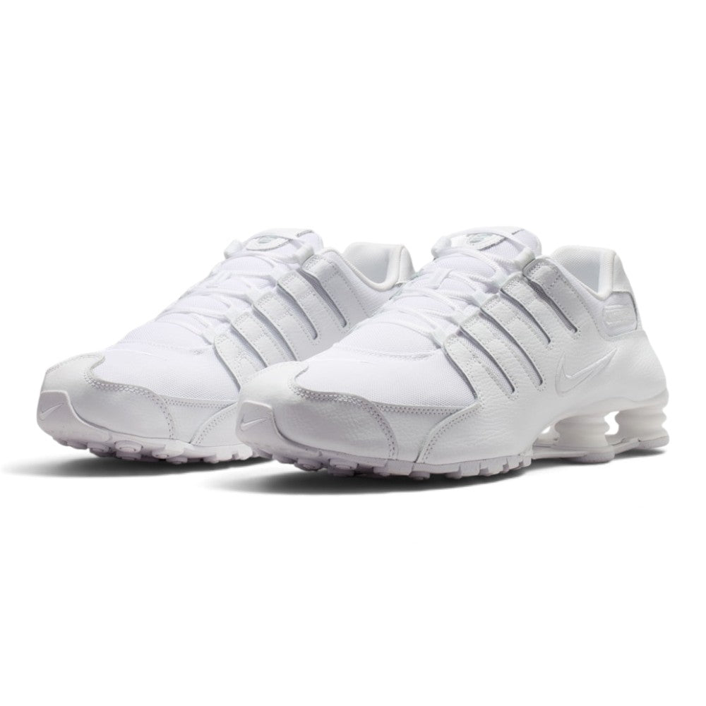 Forward three-quarter angle showcasing both shoes side by side, highlighting the aerodynamic low-profile silhouette, clean monochrome depth, mechanical heel stance, and aggressive Y2K runner shaping.