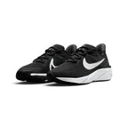 Showcasing the "unreal" clean lines, high-contrast black-and-white colourway pop, and sculpted foam silhouette from a 45-degree perspective.