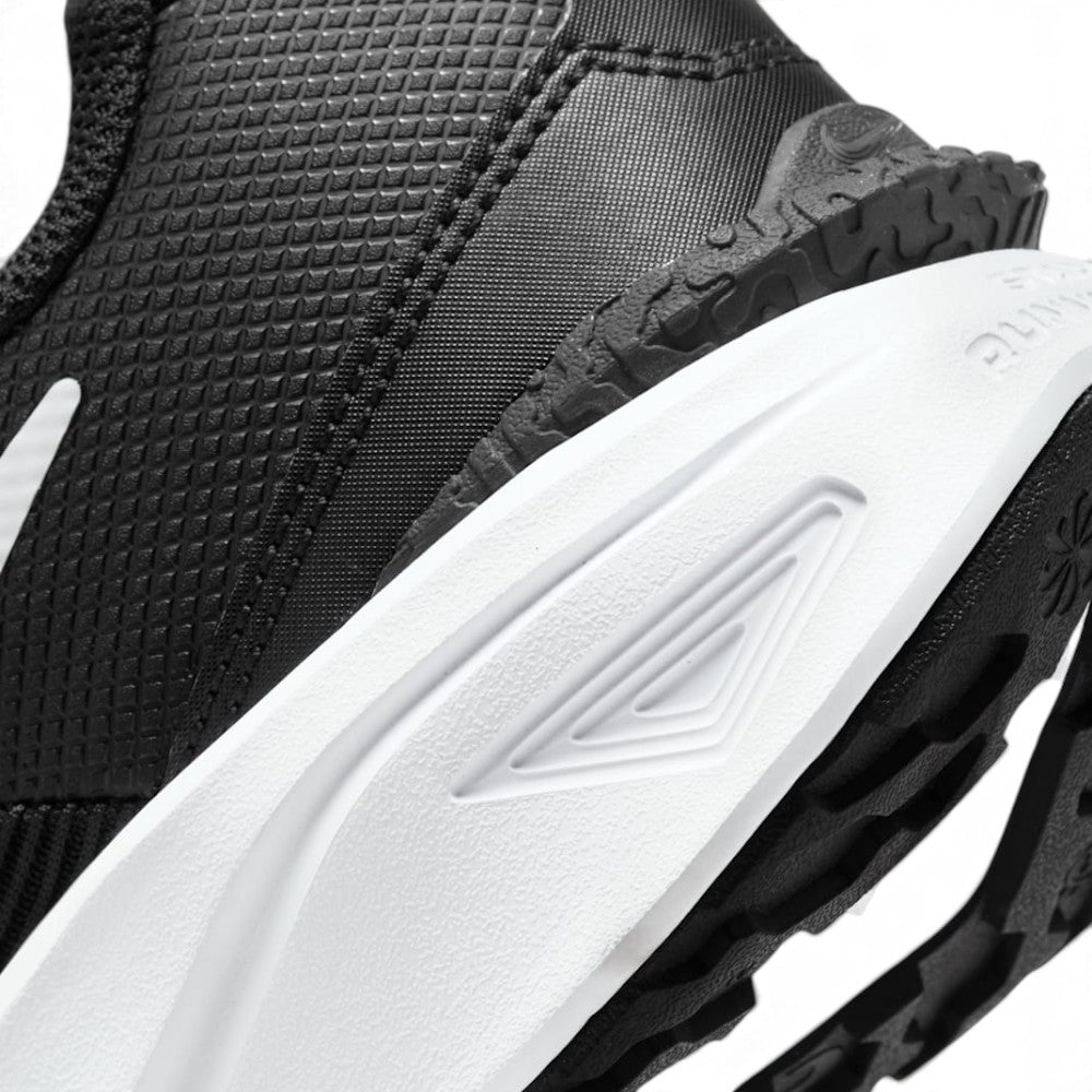 Highlighting the Sculpted Springy Foam Midsole Texture and All-Terrain Rubber Tread Edge, demonstrating the impact-absorbing foam depth and multi-surface traction hardware.