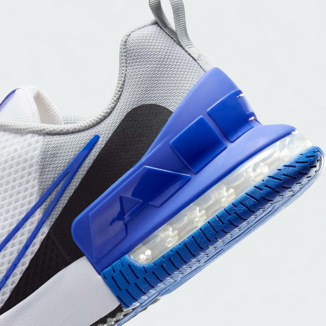 Detailed zoom on the outsole and midsole of the Nike Air Max Alpha Training Shoes Men's white, highlighting the cushioned foam, visible Max Air, and sturdy rubber extending up the sides.