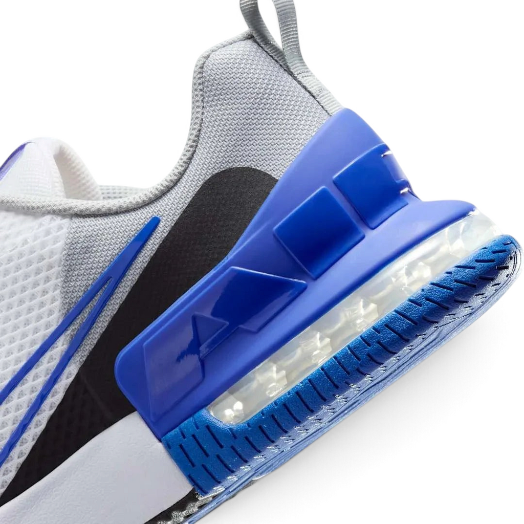 Detailed zoom on the outsole and midsole of the Nike Air Max Alpha Training Shoes Men's white, highlighting the cushioned foam, visible Max Air, and sturdy rubber extending up the sides.