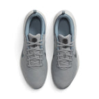 Focuses on the locked-in central lacing layout, displaying Light Smoke Grey laces, mesh tongues with Nike Downshifter branding badges, padded ankle collars, and tonal insoles.