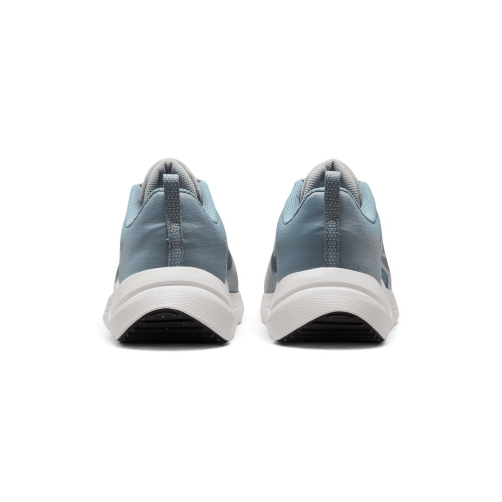 Focuses on the rear profile, highlighting the supportive grey heel counter, heel pull loop, and the wide footprint of the sculpted foam midsole base.