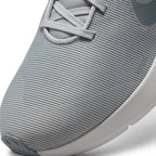 Details the micro-precision of the forefoot mesh upper, showing the reinforced synthetic toe overlay, tonal laces, and integrated midfoot lockdown webbing.