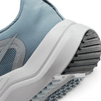 Highlights the "unreal" clean finish where the sculpted white foam midsole meets the grooved black rubber outsole tread.