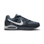 Side profile of the Nike Air Max Command Men's Trainer in Dark Obsidian, Wolf Grey, and White showing mesh upper, leather overlays, visible Max Air unit, and white Swoosh.