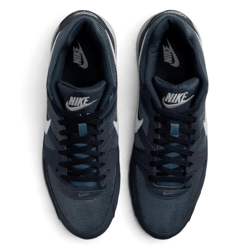 Overhead view of both sneakers showing the breathable mesh forefeet, central lacing systems, and branded tongue labels.