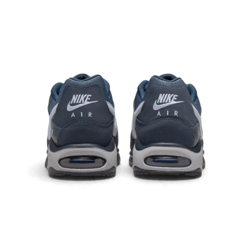 Rear view of the sneakers emphasising the heel counters, visible Max Air windows, and textured sole wraps.