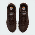 Top-Down View of Pair: Looking down at the tonal leather lacing system and the streamlined, low-profile silhouette.