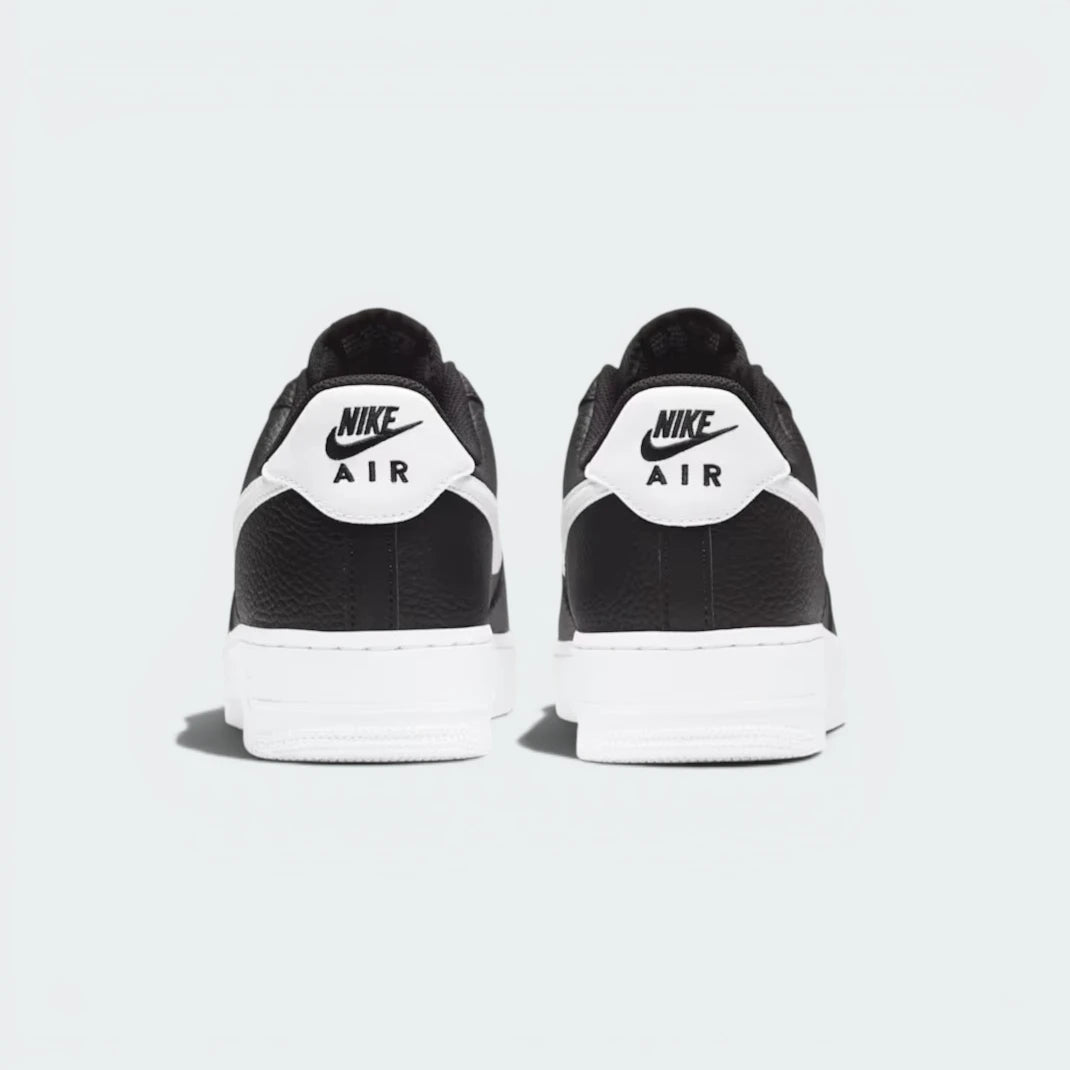 Focuses on the embroidered Nike Air branding and the professional finish of the heel construction.