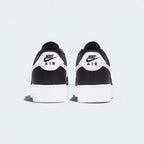 Focuses on the embroidered Nike Air branding and the professional finish of the heel construction.