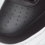 Details the high-definition leather grain and the precision of the AF1 lace dubrae.