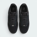 Focuses on the locked-in traditional lacing layout, displaying the perfect symmetry of the canvas tongue, the matching anthracite laces, and the neat stitching lines tracking down the textured canvas toe box area.