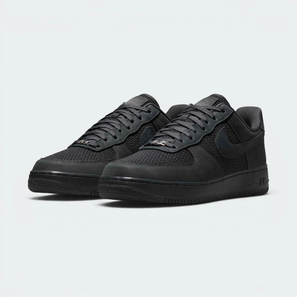 Emphasising the legendary, chunky court stance and the professional harmony of the monochromatic grey-on-black textured panels.