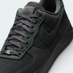 Details the premium precision of the stitching wrapping the durable leather toe cap protection matrix and the neat configuration of the laces over the canvas tongue.