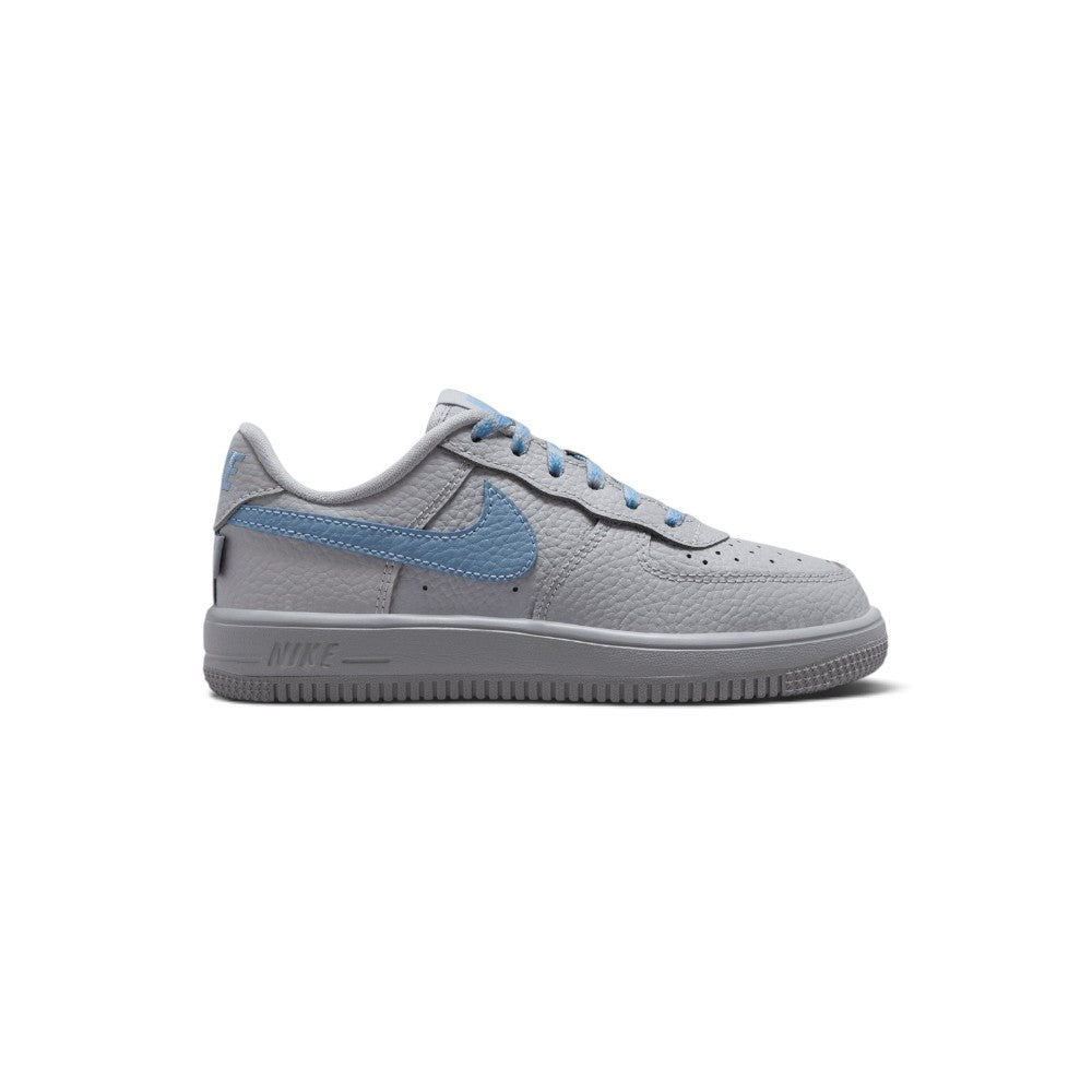 Capturing the iconic 1982 low-top silhouette, detailing the smooth wolf grey leather upper, vibrant work blue lateral Swoosh, stitched grey rubber cupsole sidewall, and padded collar line.