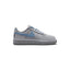 Capturing the iconic 1982 low-top silhouette, detailing the smooth wolf grey leather upper, vibrant work blue lateral Swoosh, stitched grey rubber cupsole sidewall, and padded collar line.