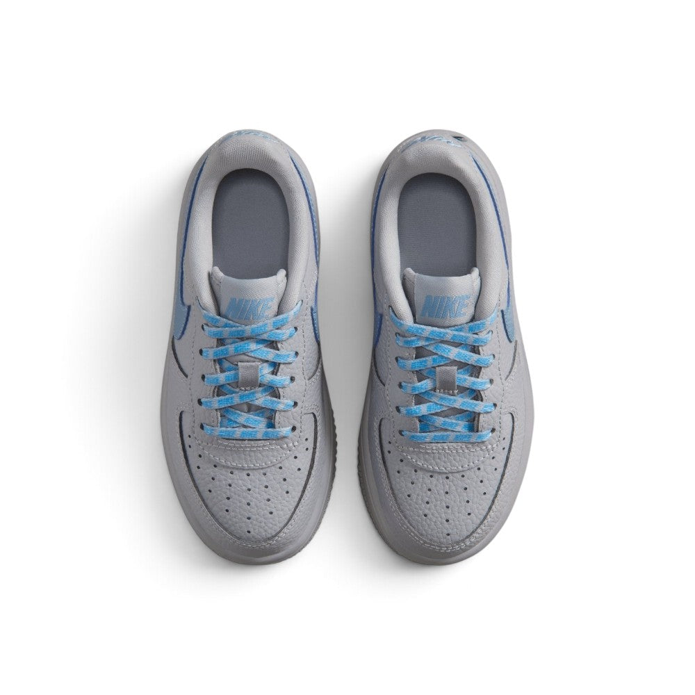 Highlighting the symmetrical central lacing throat, flat grey laces, perforated toe box, padded tongue with Nike Air Force 1 branding, and vibrant work blue sockliner, demonstrating the upper template constructed for a comfortable "locked-in" fit.