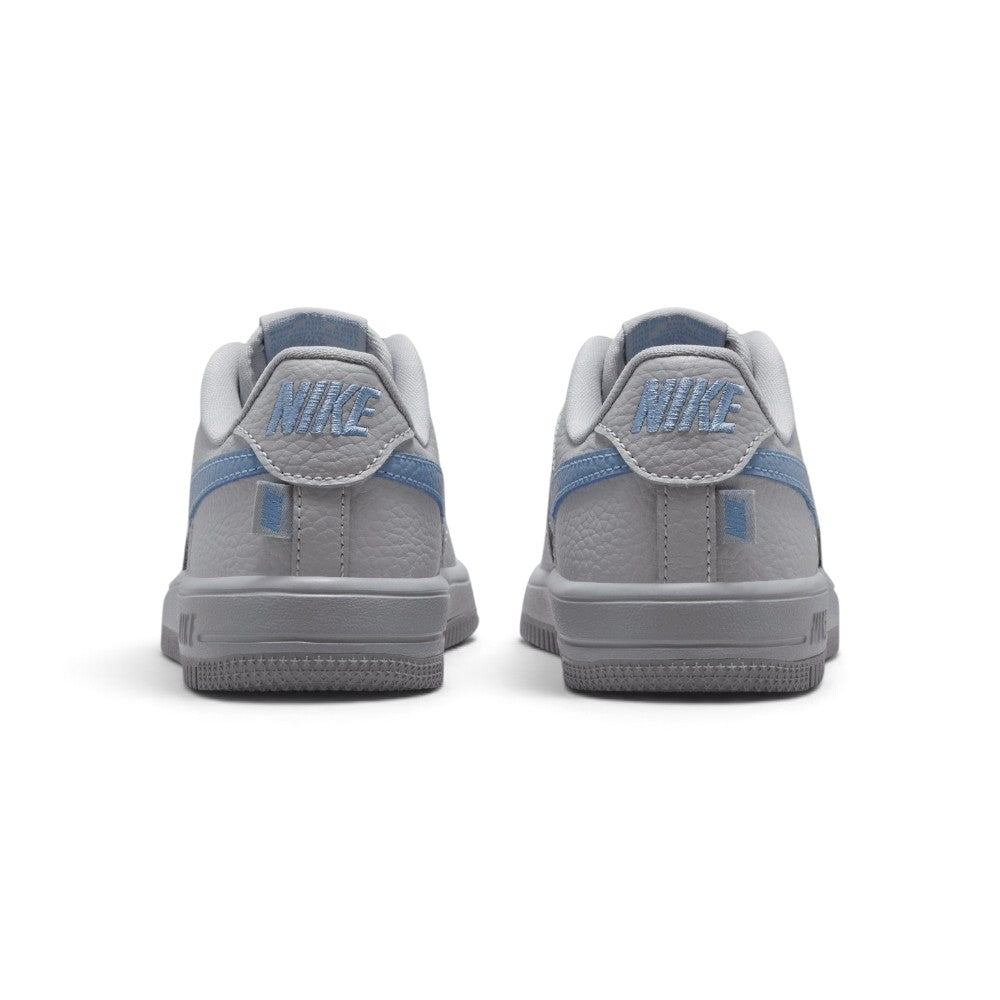 Showing the structured rear heel counter, detailing the work blue leather heel tab with embroidered grey Nike Air branding, reinforced heel overlay, and stitched cupsole base.