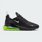 Highlights the high-velocity sweep of the small white Nike Swoosh, showing the breathable black engineered mesh upper, the black heel clip, and the massive translucent Volt green 270 Max Air heel unit sitting cleanly above the black foam forefoot.