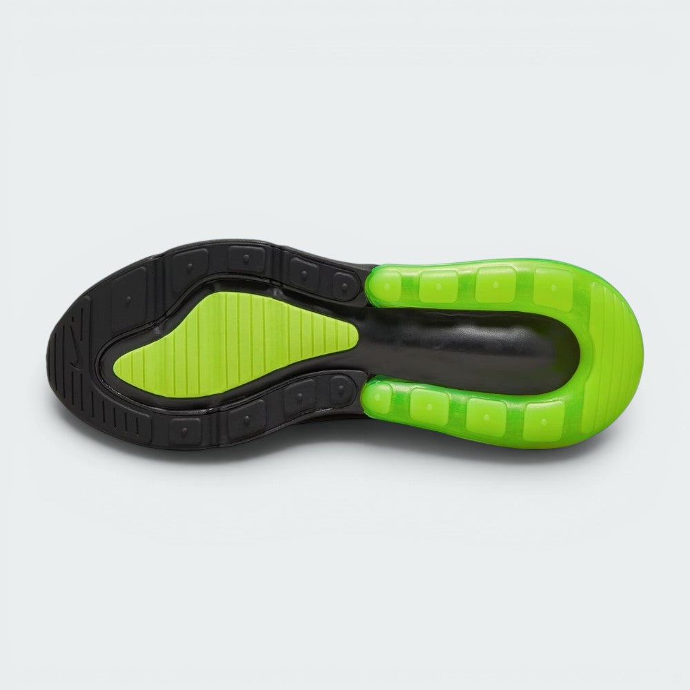 Displays the multi-surface rubber sole, showcasing the dark black forefoot traction grid interlocked with a bright Volt green rubber heel ring framing the central Air unit cavity.