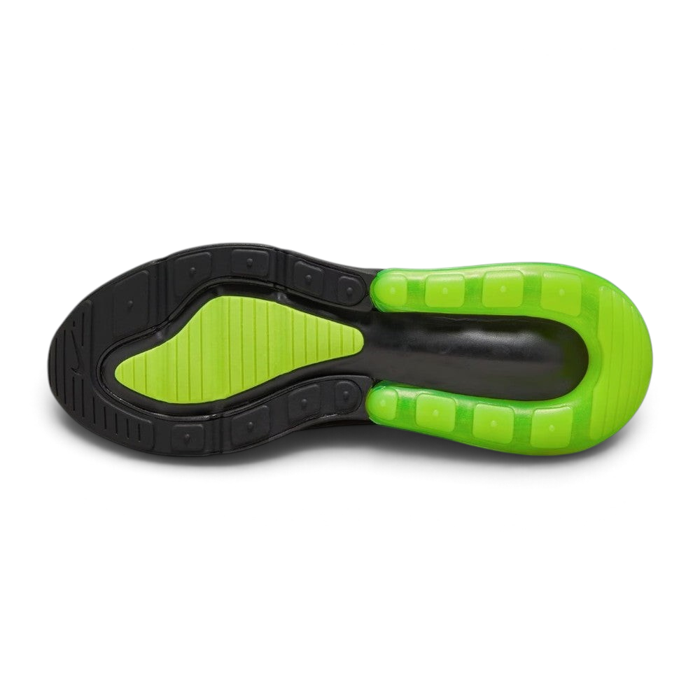 Displays the multi-surface rubber sole, showcasing the dark black forefoot traction grid interlocked with a bright Volt green rubber heel ring framing the central Air unit cavity.