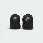Focuses on the contoured shape of the rear spine, highlighting the ribbed TPU heel patch embedded with classic Nike Air block text branding.