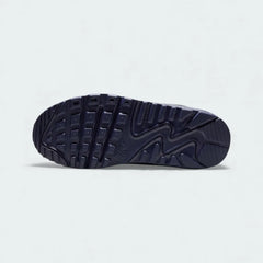 View of the outsole of the Nike Air Max 90 Leather Juniors' blue trainers, showing the durable rubber waffle tread pattern.