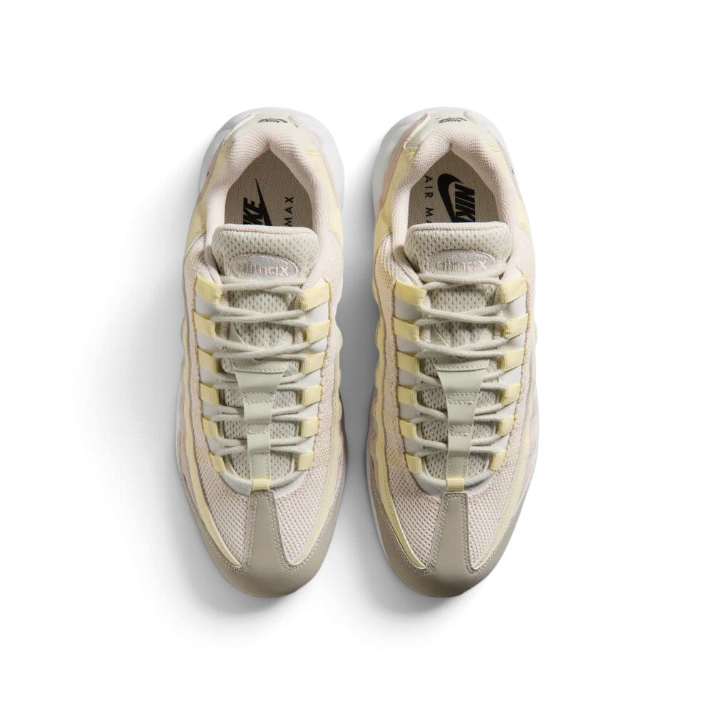Direct overhead view of both shoes laid flat, showcasing the mesh tongue panels, anatomical webbed lace loops threaded with tonal laces, branded insoles, and streamlined toe box proportions.