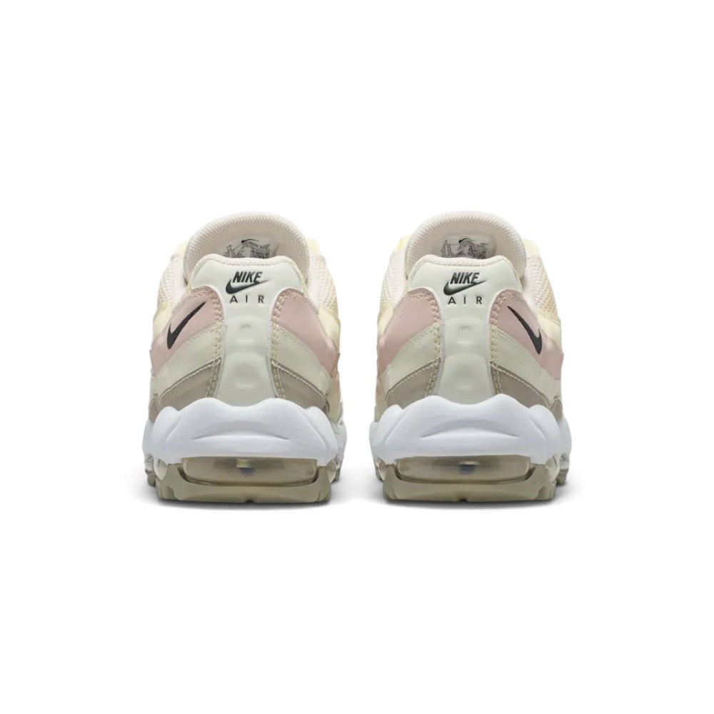 Close-up rear angle focusing on the stacked synthetic heel panels, embroidered "NIKE AIR" branding, the curved white midsole wrap, and the rear Max Air window.