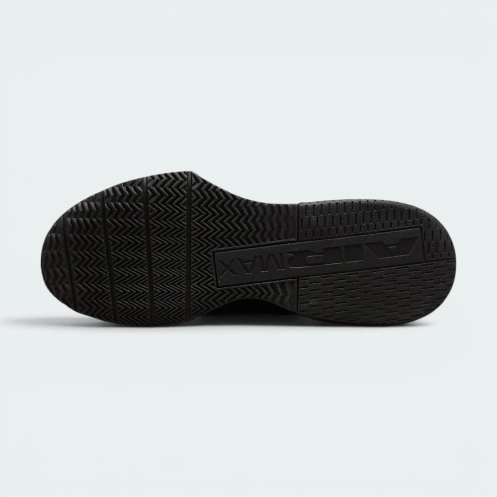Displays the flat, wide sole plate and its enhanced rubber tread pattern, engineered for unreal multi-surface traction on rubber gym mats.