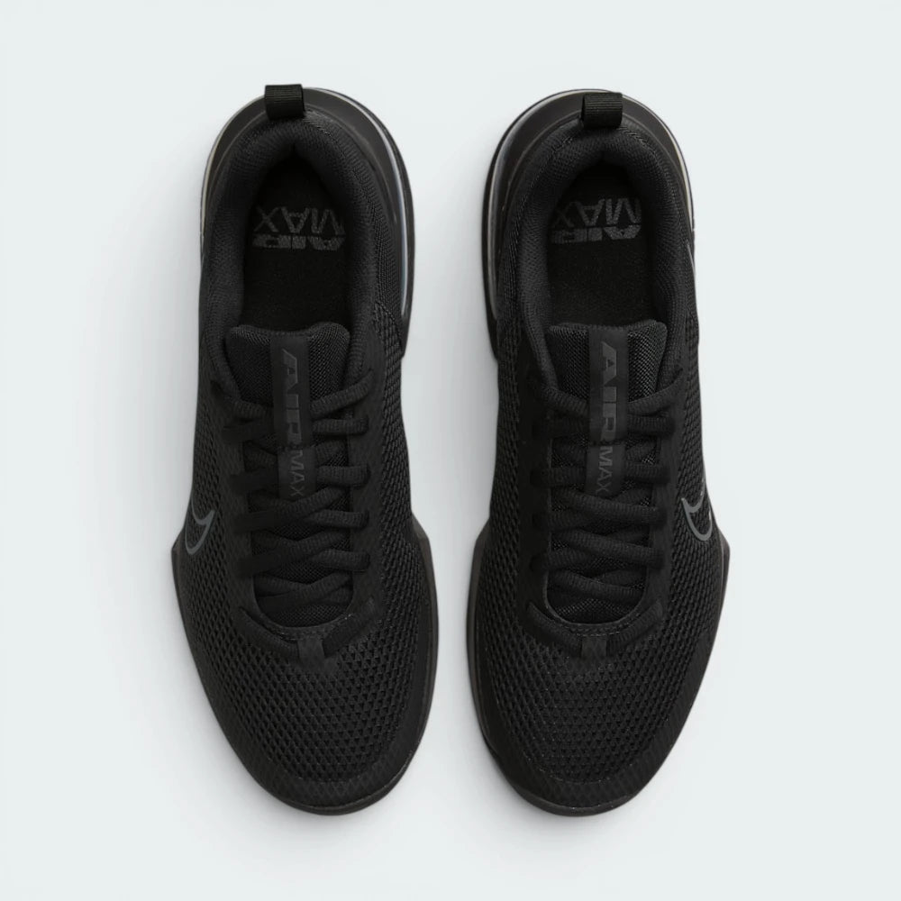 Focuses on the locked-in lace closure layout, the tight technical weave of the black mesh toe box, and the durable texturing covering the tongue.