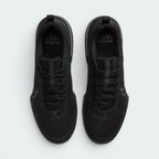 Focuses on the locked-in lace closure layout, the tight technical weave of the black mesh toe box, and the durable texturing covering the tongue.
