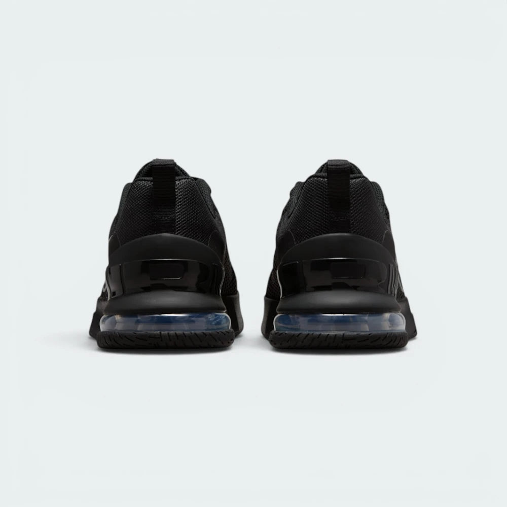 Focuses on the heavy-duty robust heel structure surrounding the visible Air window and the clean finish of the protective ankle collar.